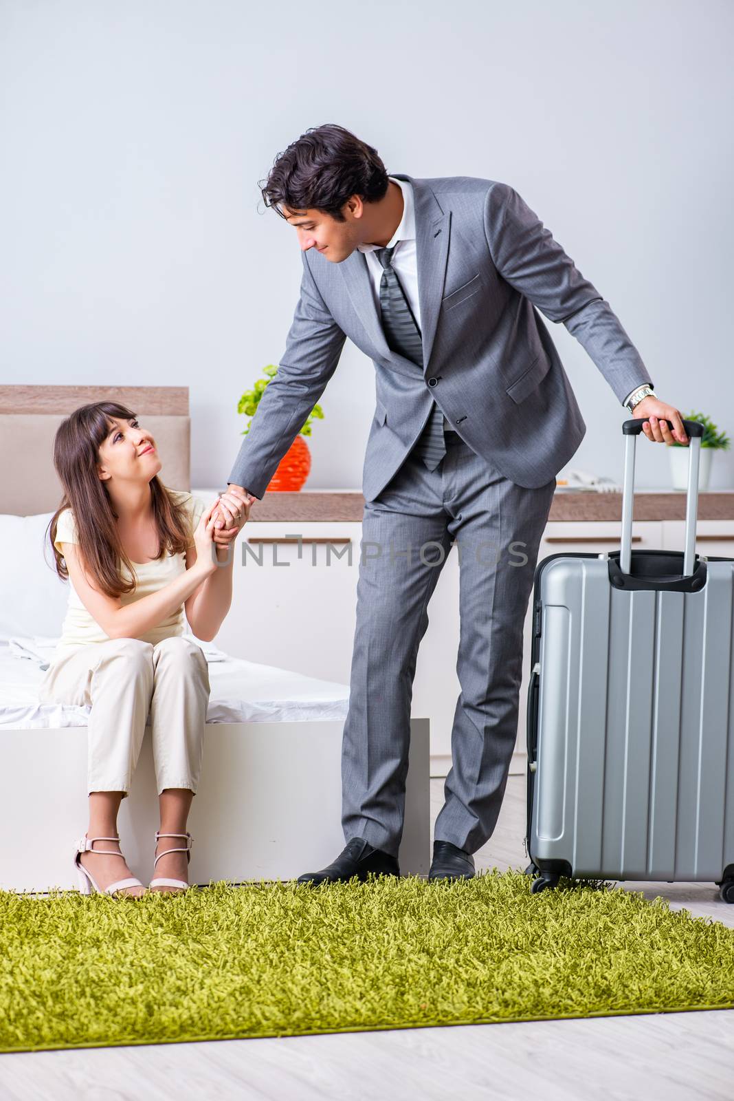Wife seeing her husband off to business trip