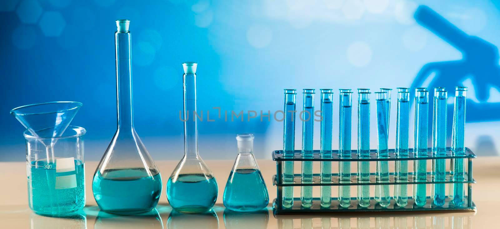 Laboratory beakers,Science experiment, blue background by JanPietruszka