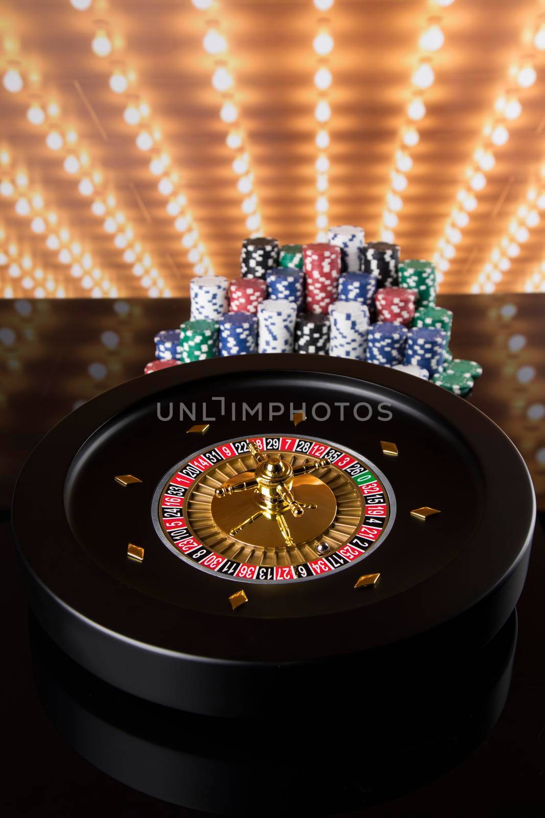Roulette wheel in motion in a casino background