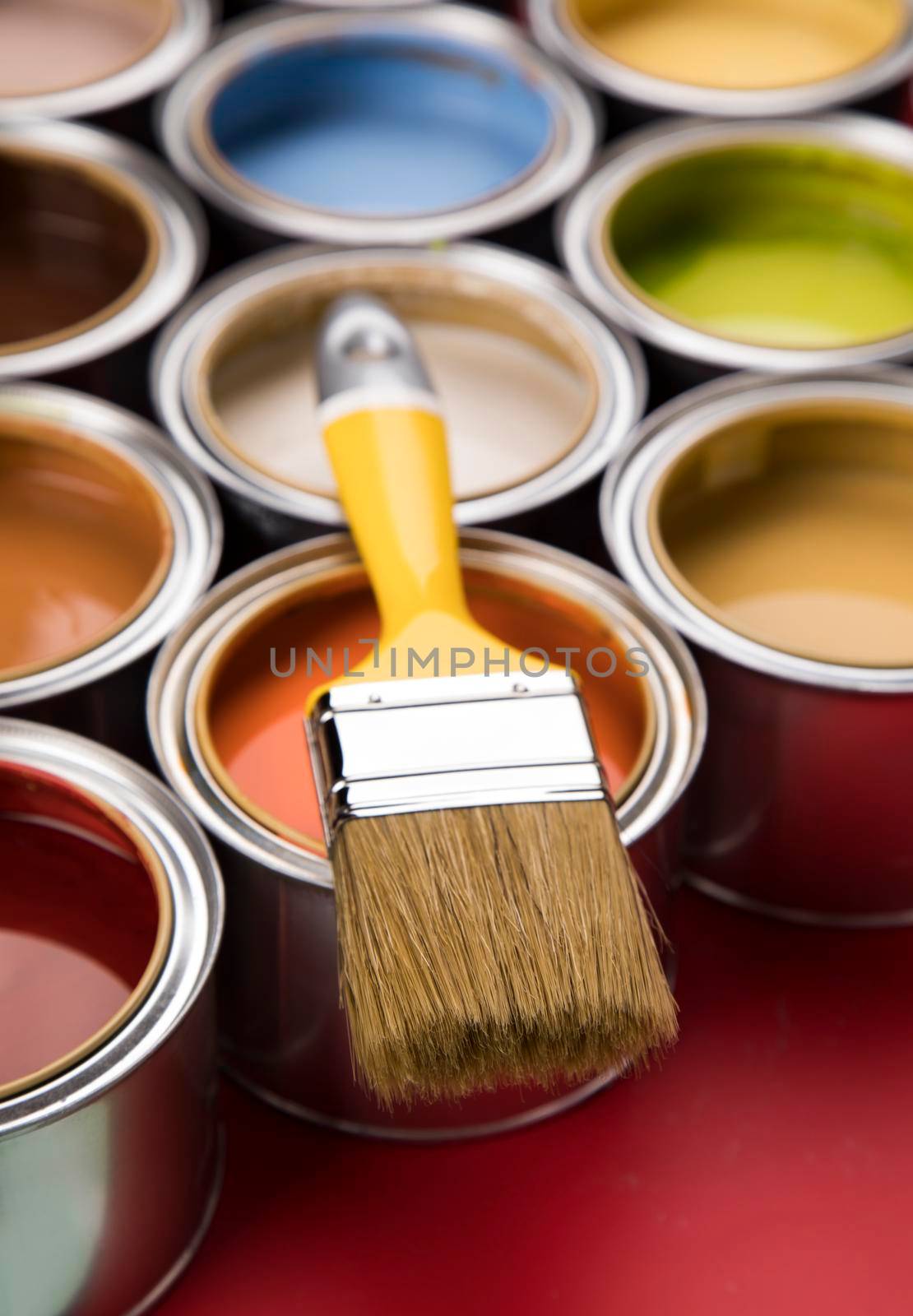 Paint can with a paintbrush