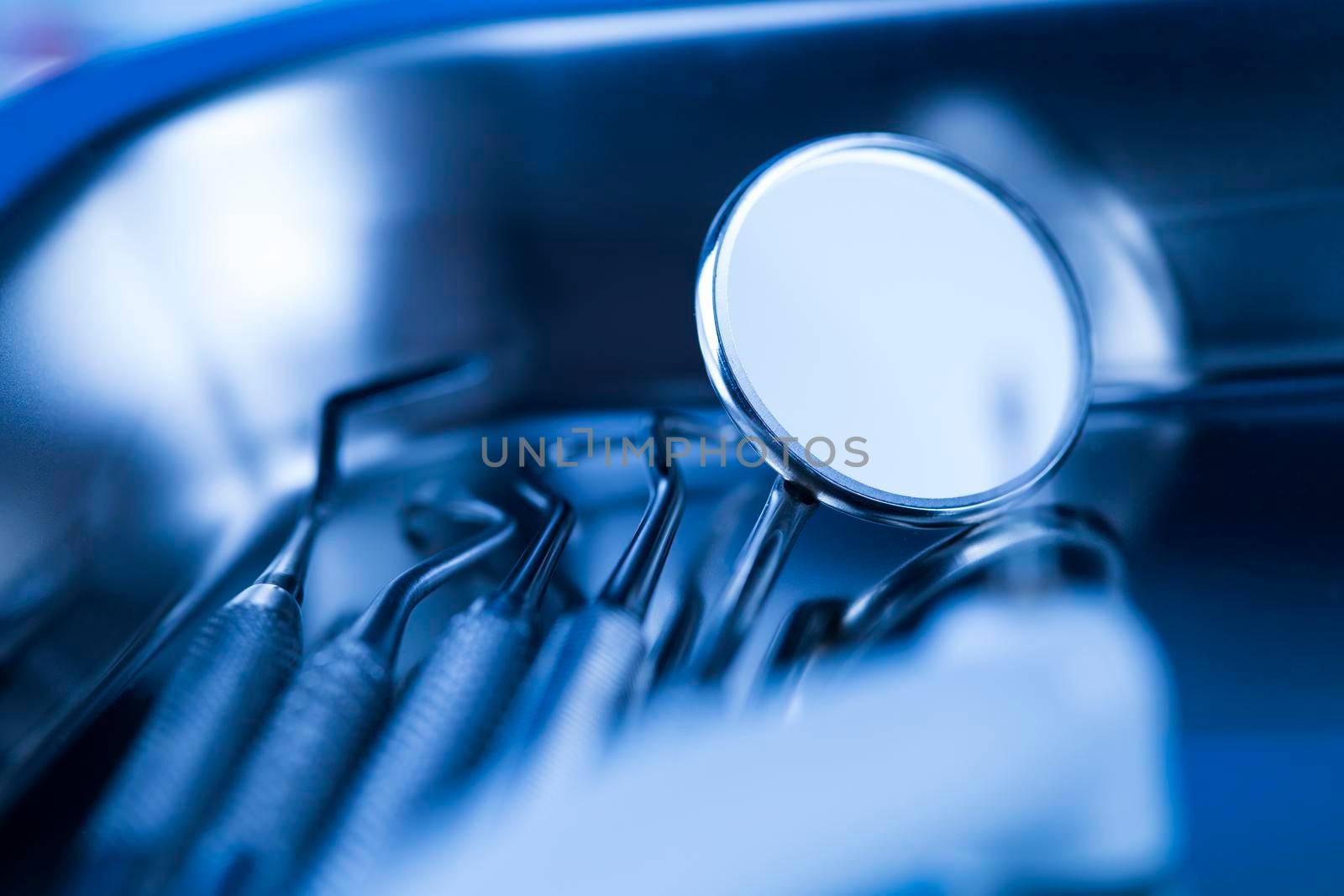 Dentist equipment on blue background