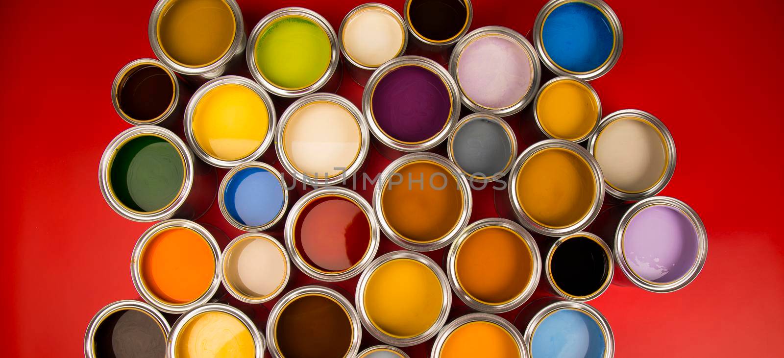Collection of colored paints cans by JanPietruszka