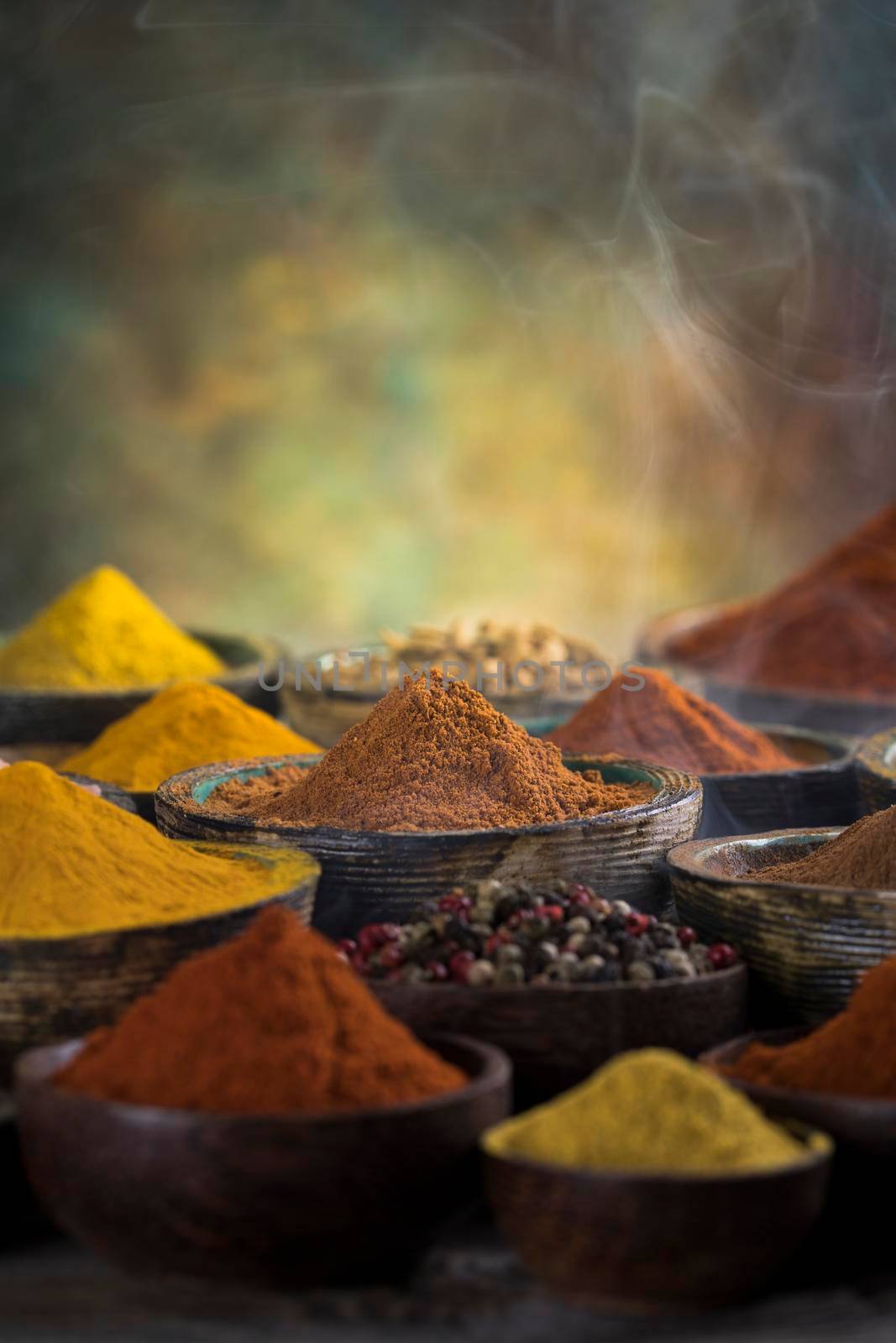 Assorted Spices and wooden bowl of smoke