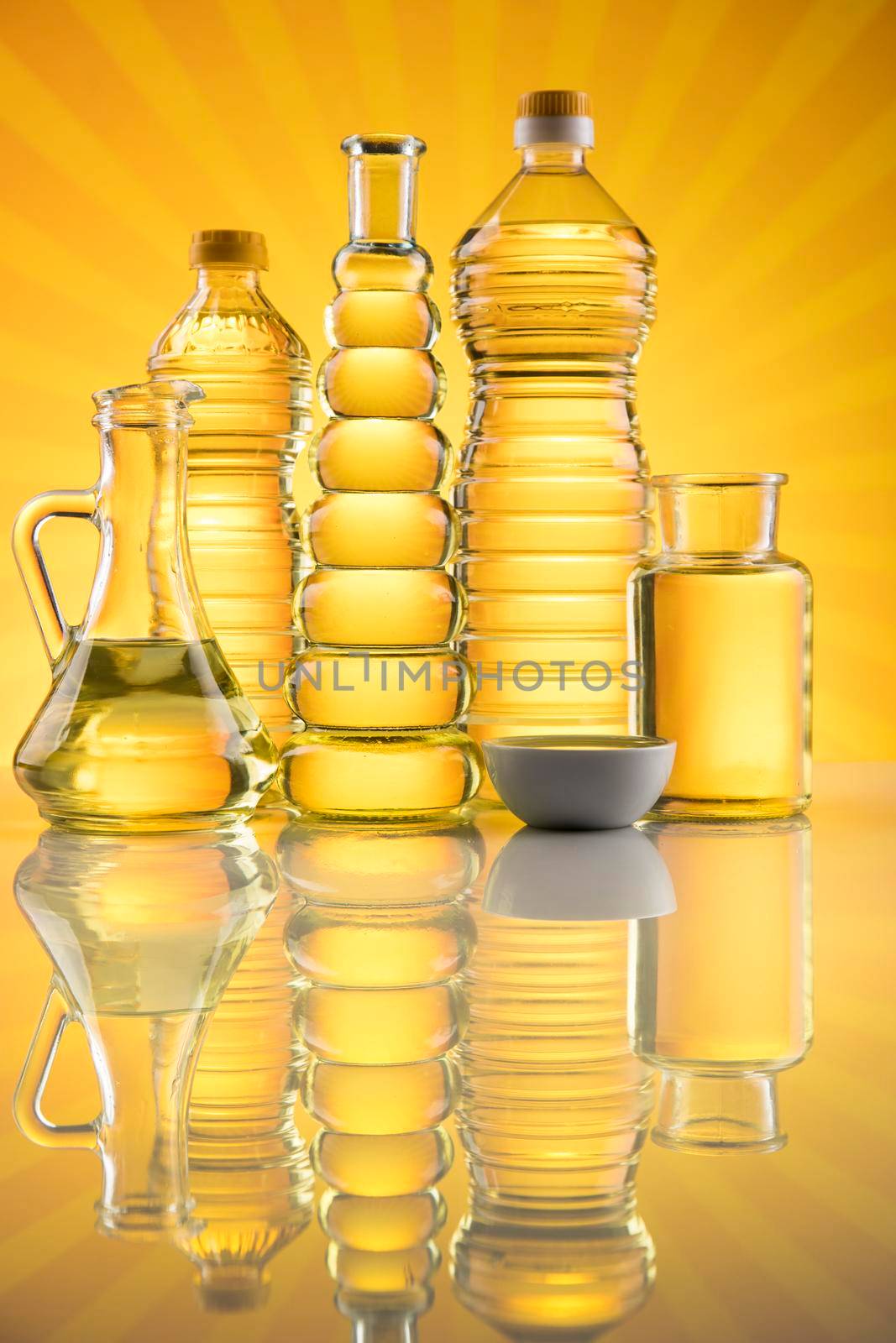 Bottles of olive oil, olive branch and Cooking oils  by JanPietruszka