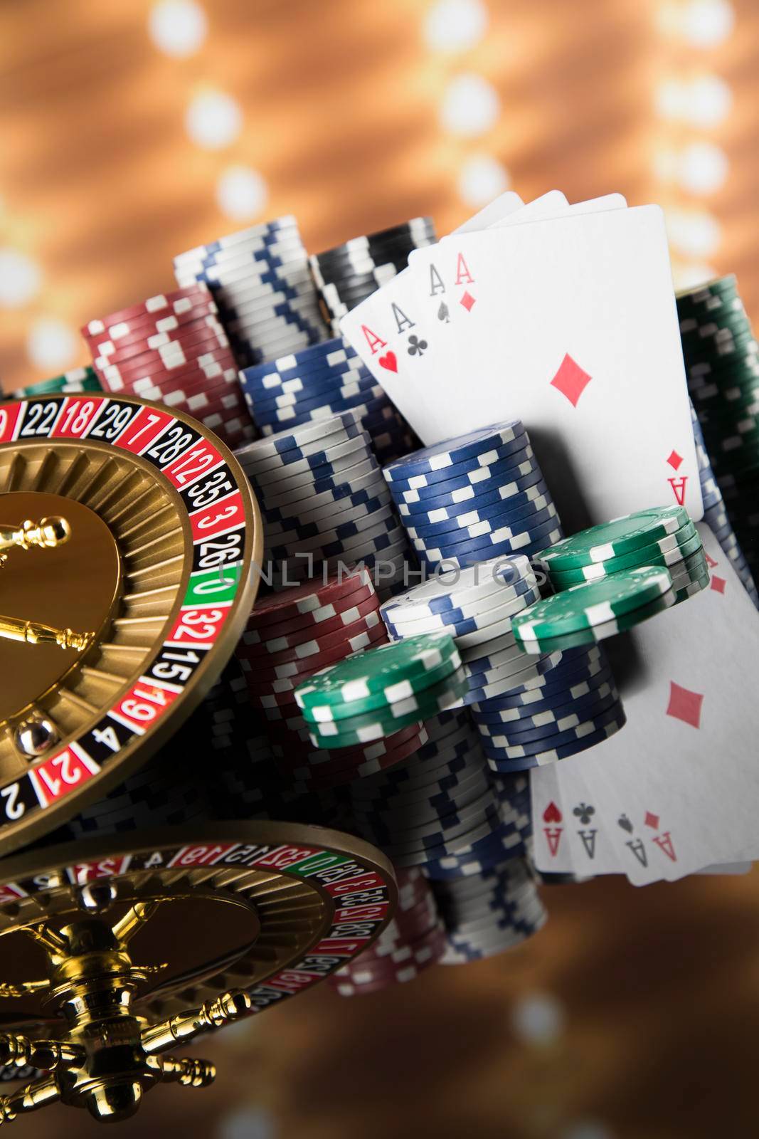 Poker Chips, Roulette wheel in motion, casino background  by JanPietruszka