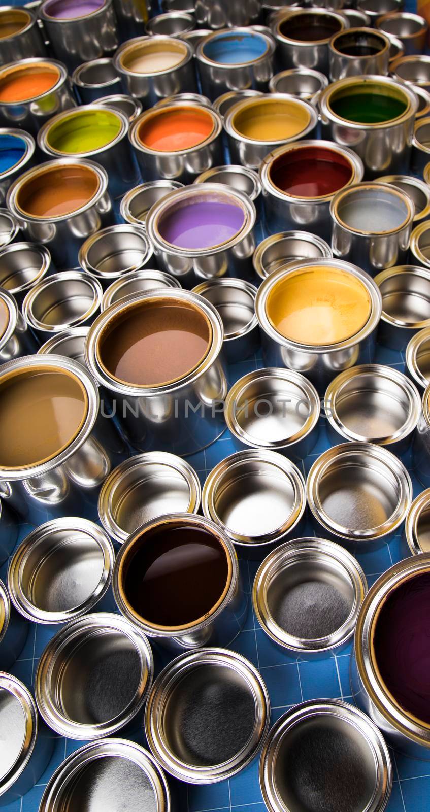 Group of tin metal cans with color paint by JanPietruszka