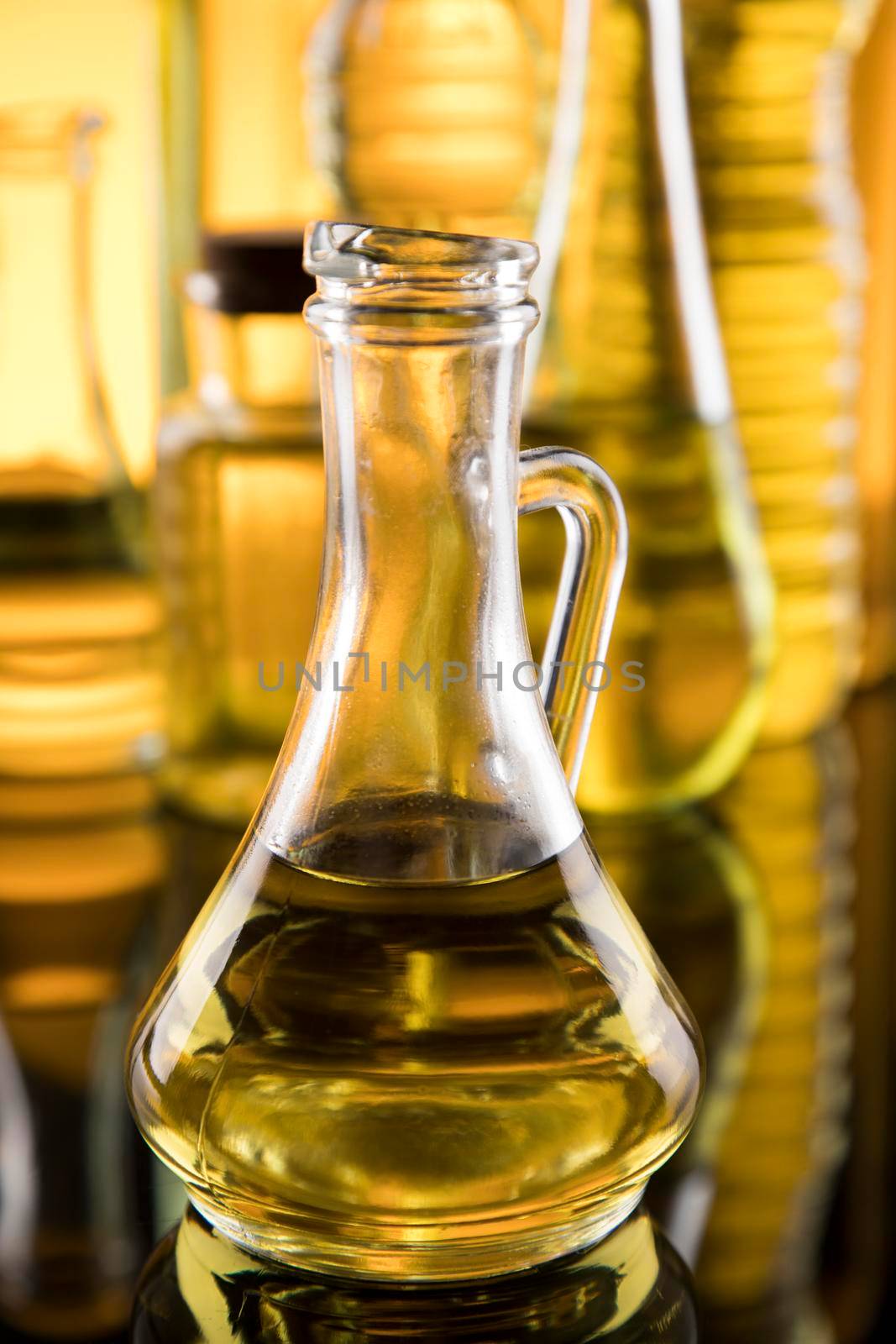 Bottles with organic cooking olive oil by JanPietruszka