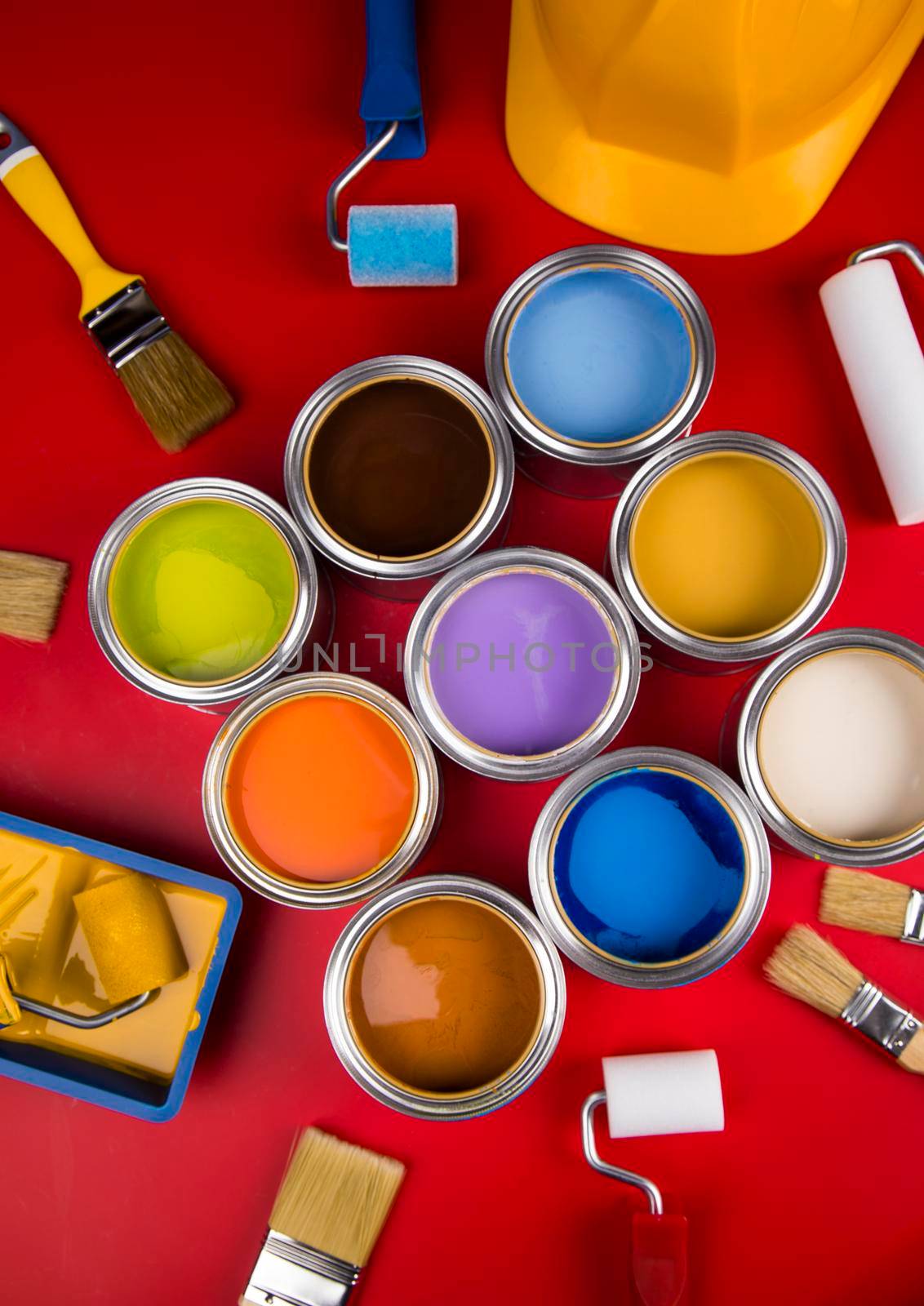Metal tin cans with color paint and paintbrush by JanPietruszka