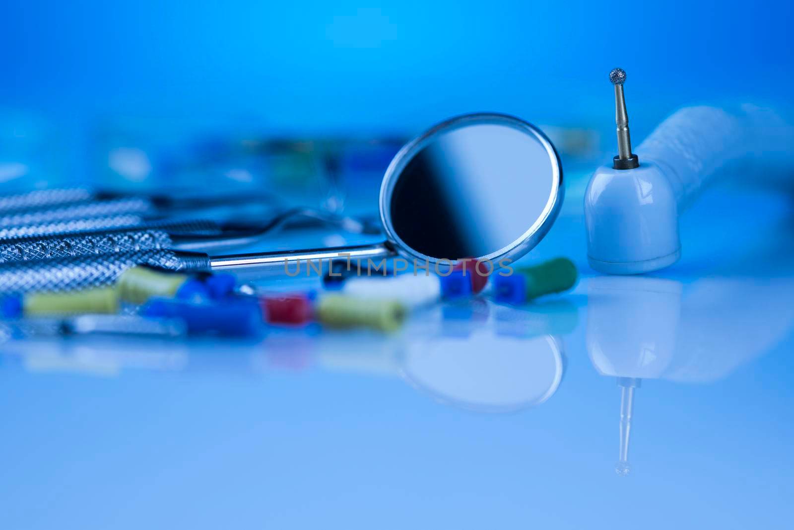 Dentist equipment on blue background by JanPietruszka