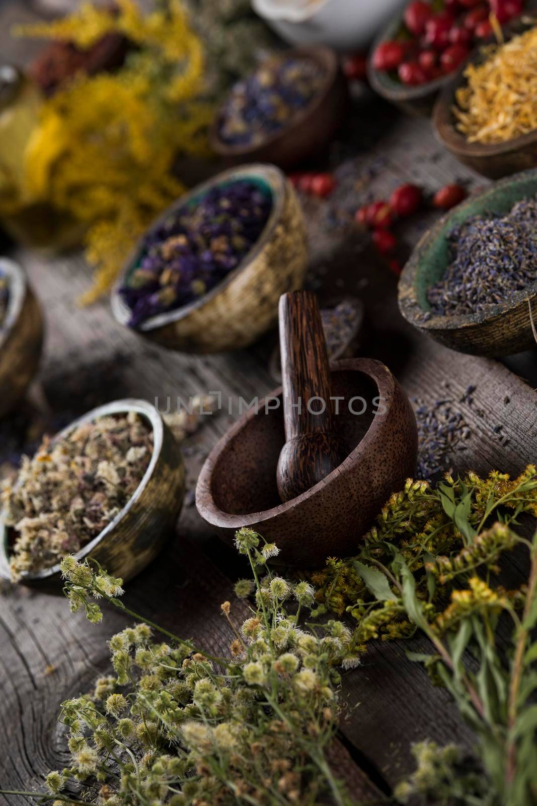 Natural remedy,Herbal medicine and wooden table background by JanPietruszka