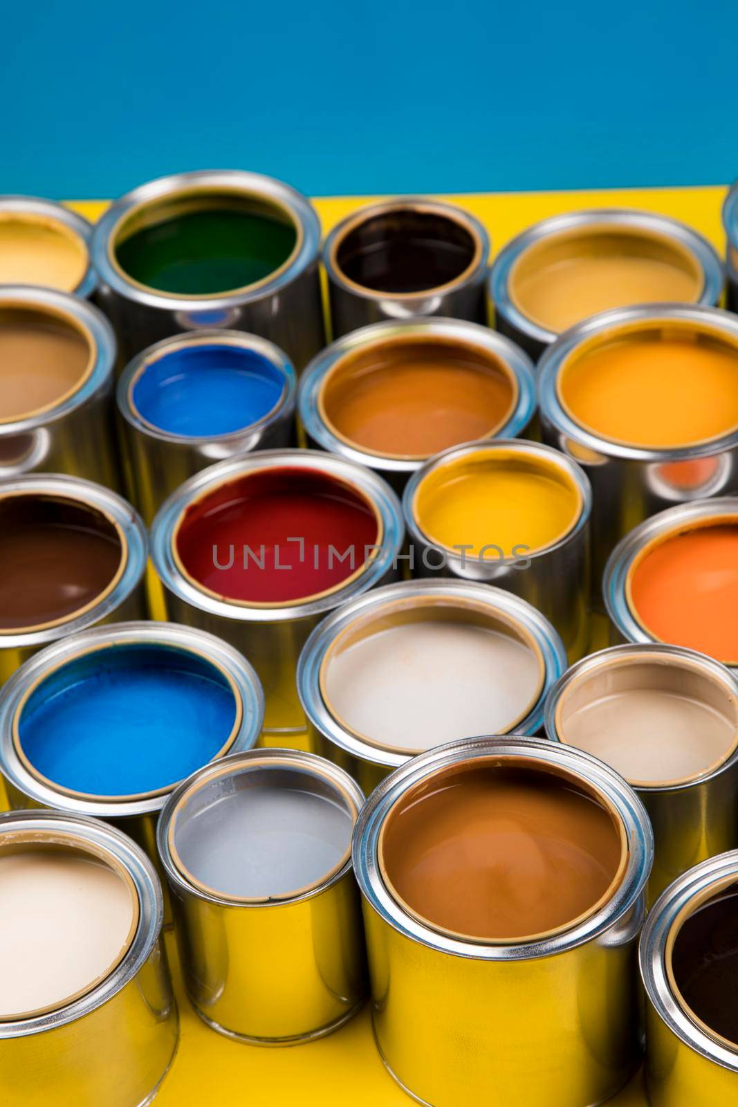 Collection of colored paints cans by JanPietruszka