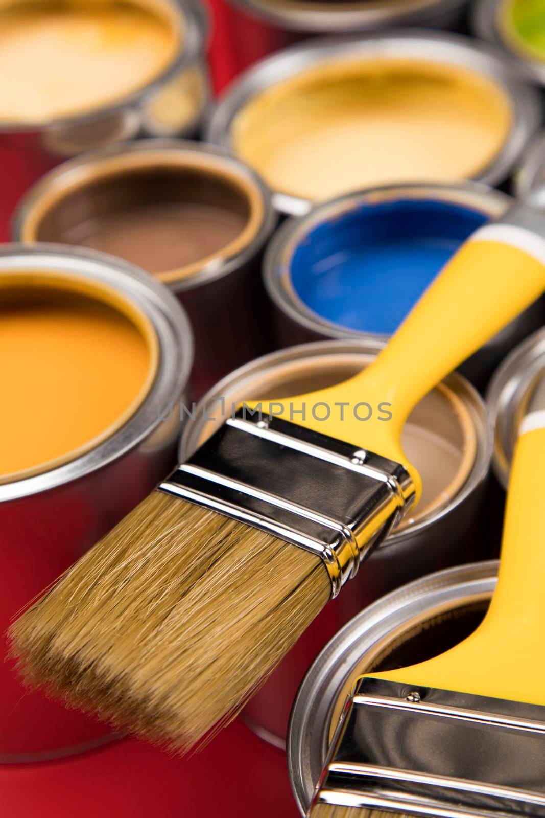 Open paint cans with a brush, Rainbow colors