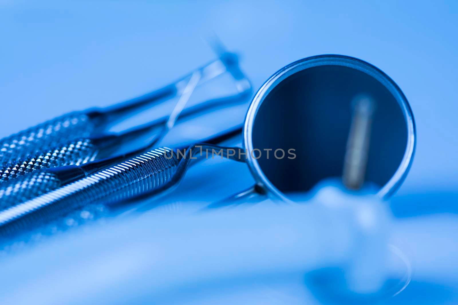 Dentist equipment on blue background