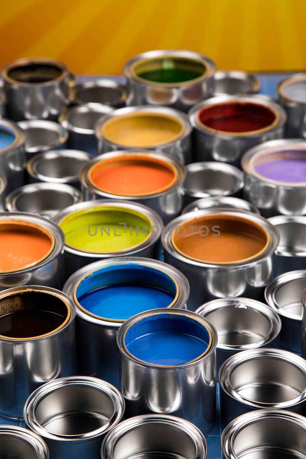 Group of tin metal cans with color paint by JanPietruszka