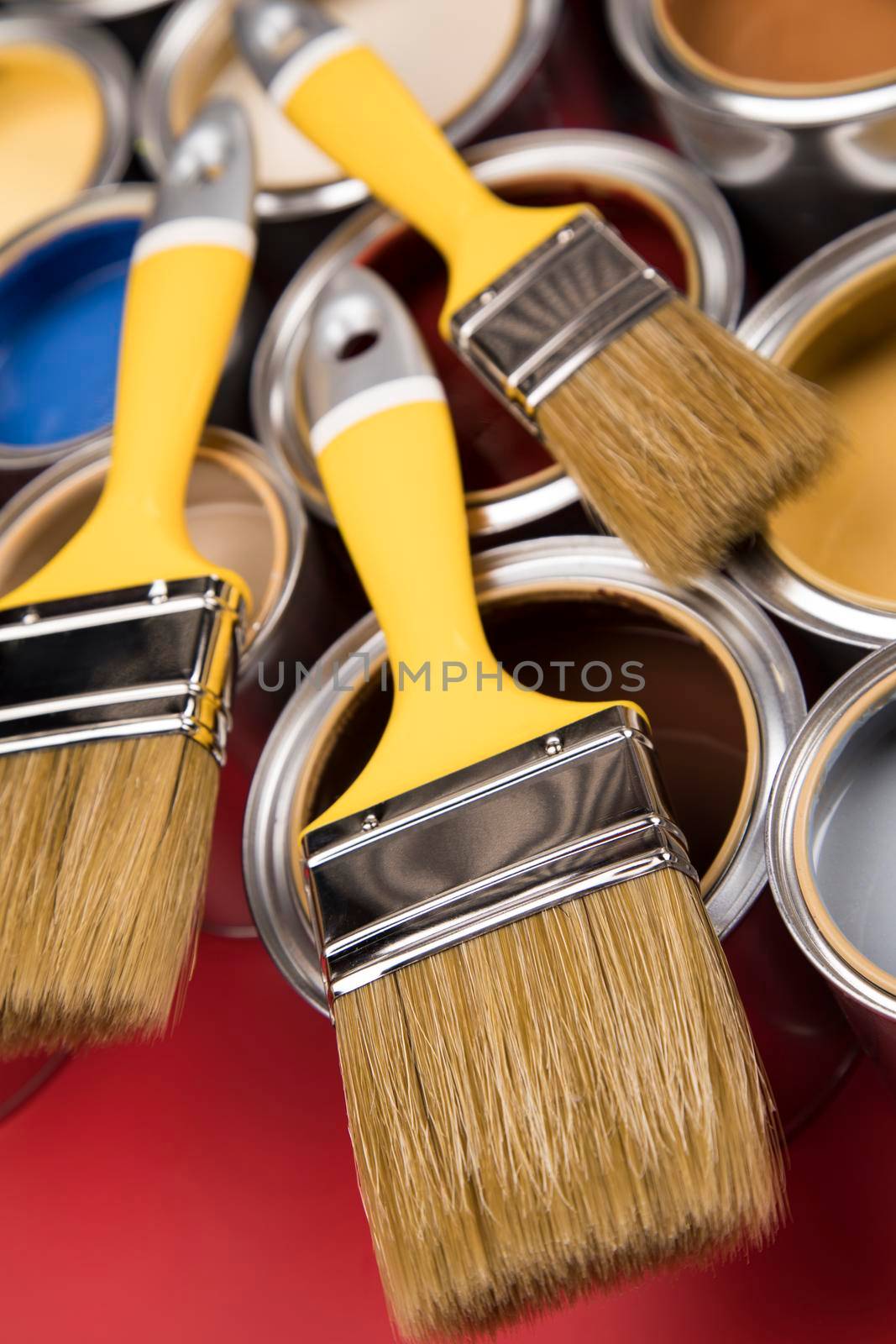 Open paint cans with a brush, Rainbow colors