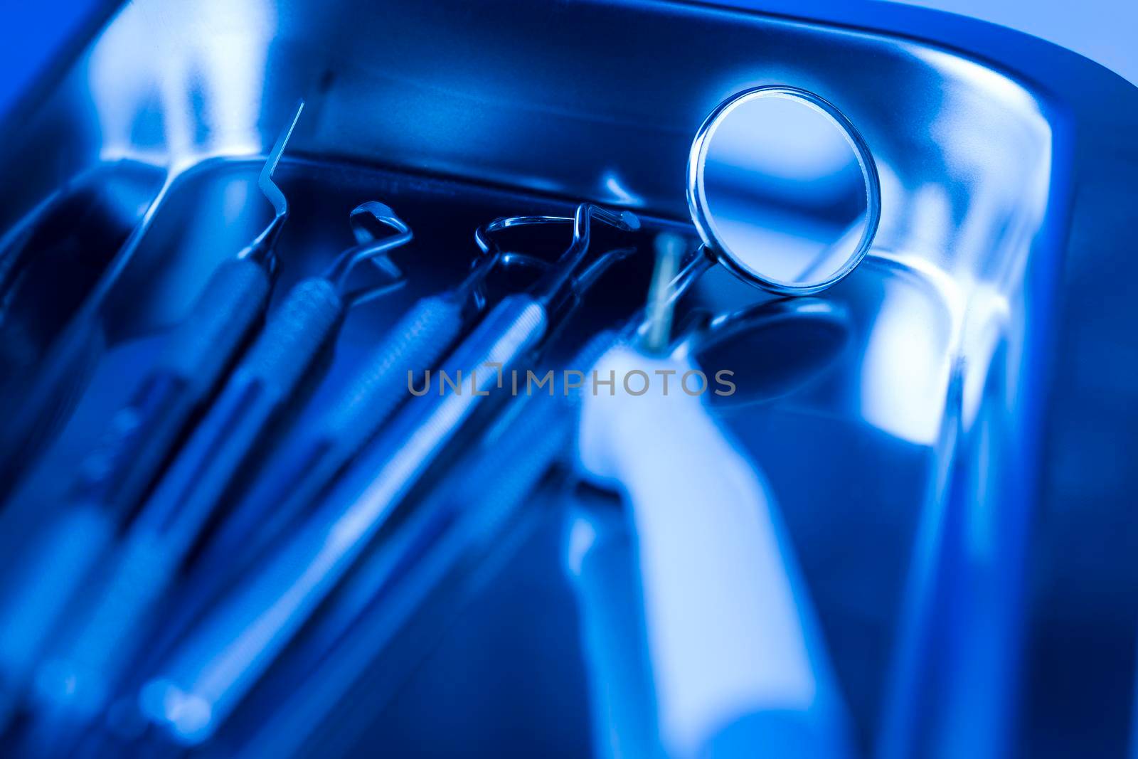 Dentist equipment on blue background
