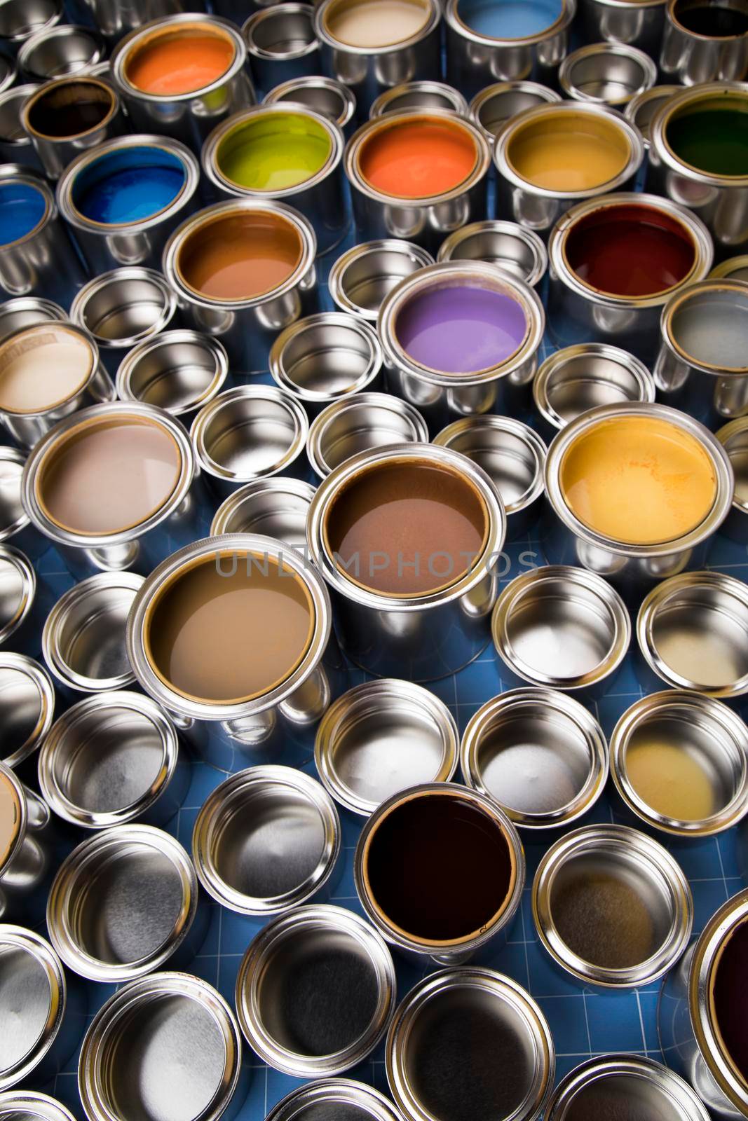 Group of tin metal cans with color paint by JanPietruszka