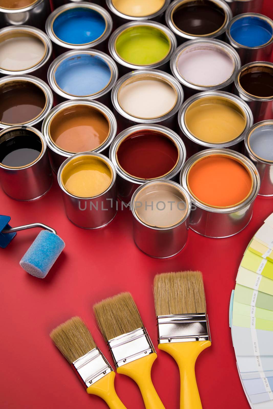 Open paint cans with a brush, Rainbow colors