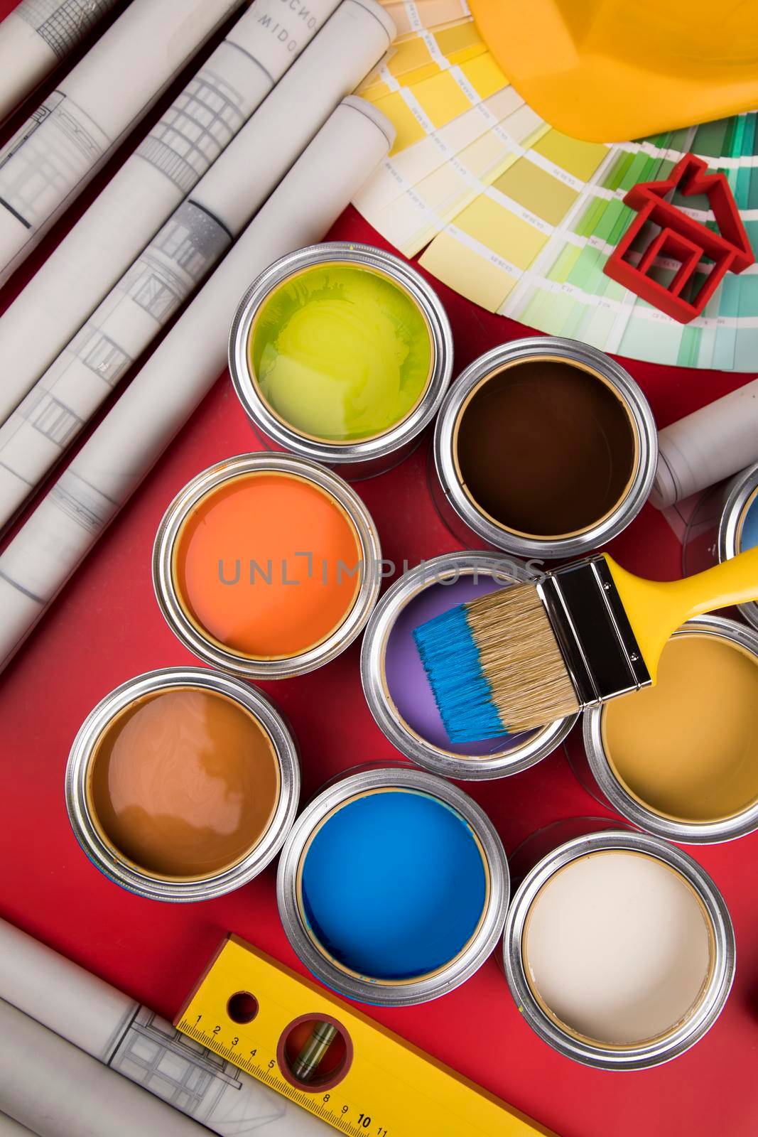Metal tin cans with color paint and paintbrush by JanPietruszka