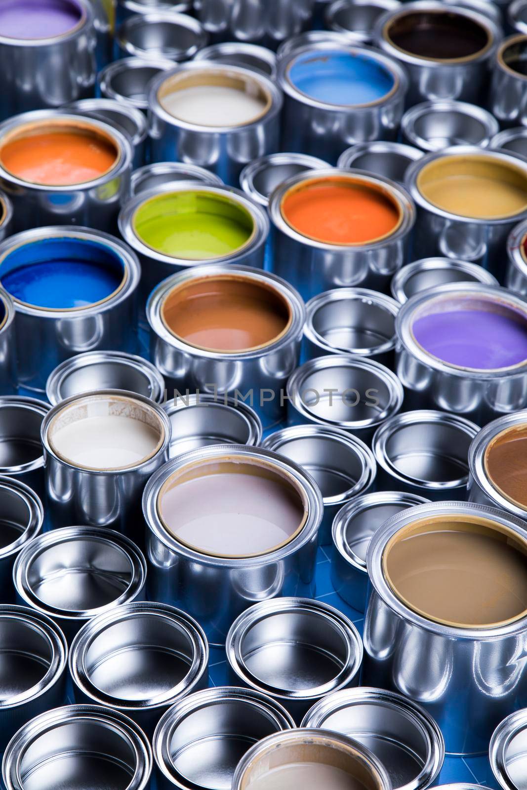 Group of tin metal cans with color paint by JanPietruszka