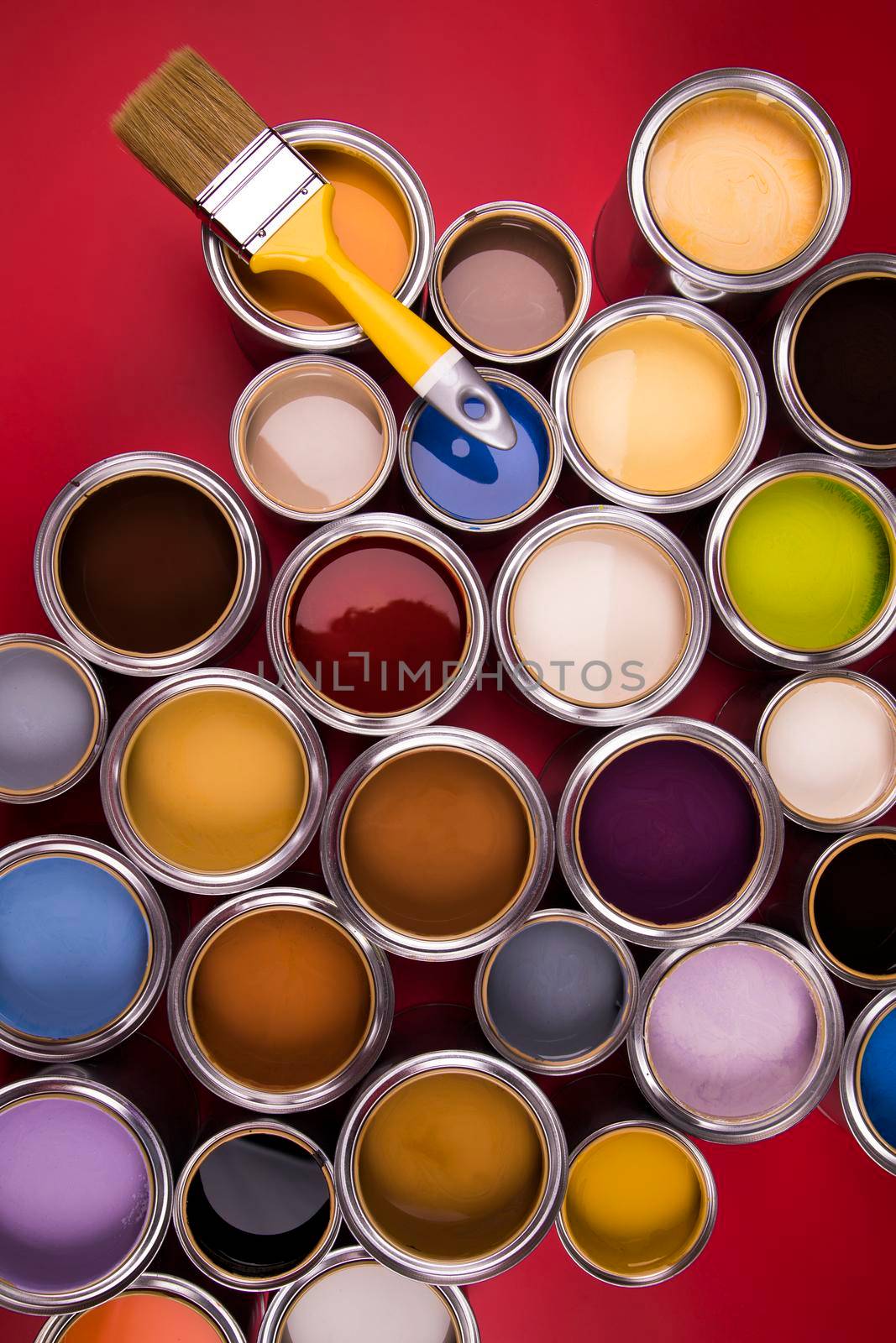 Open paint cans with a brush, Rainbow colors