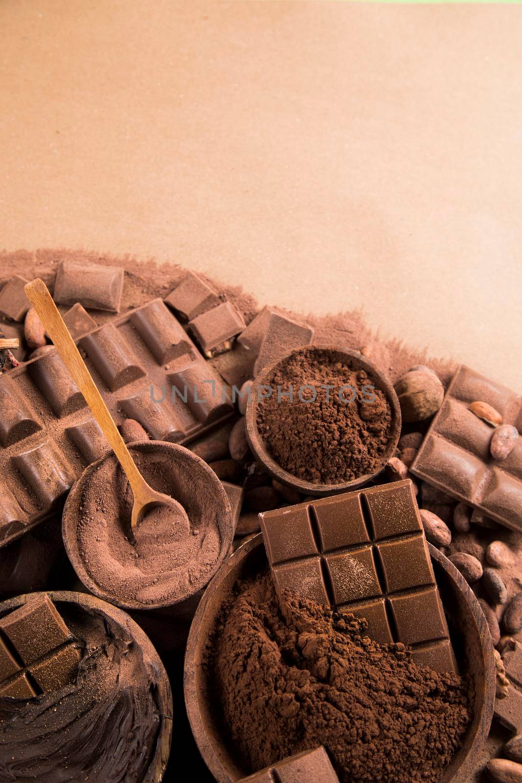 Aromatic cocoa and chocolate on natural paper background