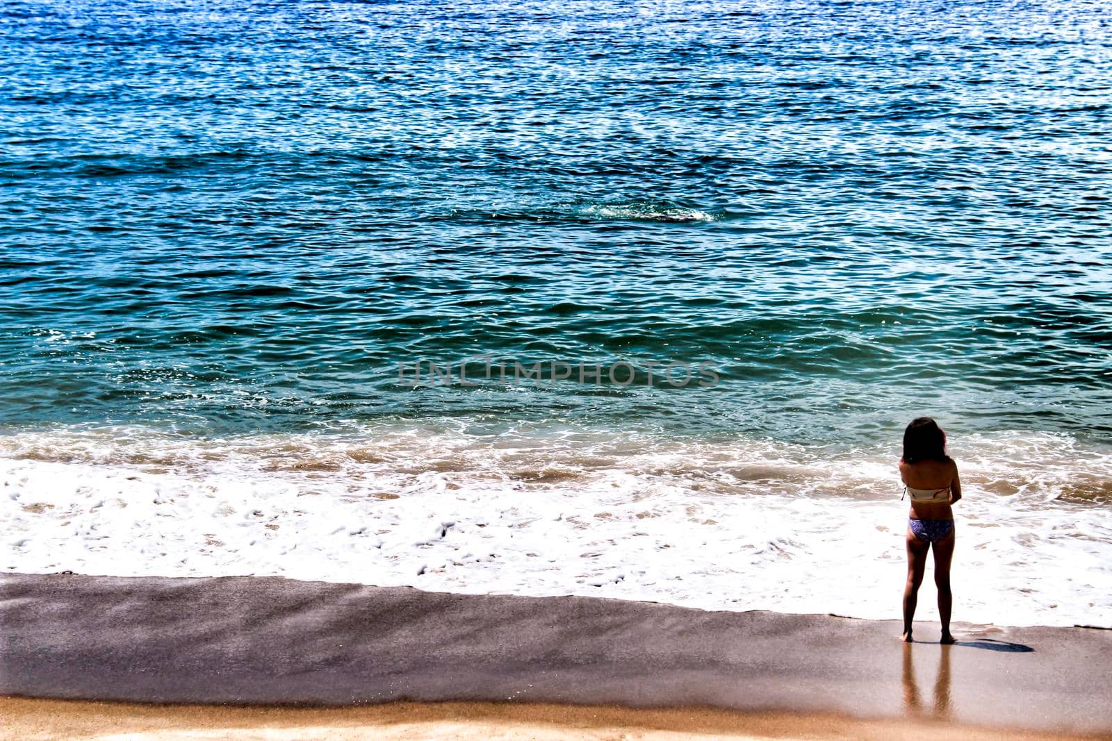 Sesimbra, Lisbon, Portugal- June 1, 2018: Views of the Sesimbra Beach and tourists watching the Atlantic Ocean in a sunny day.
