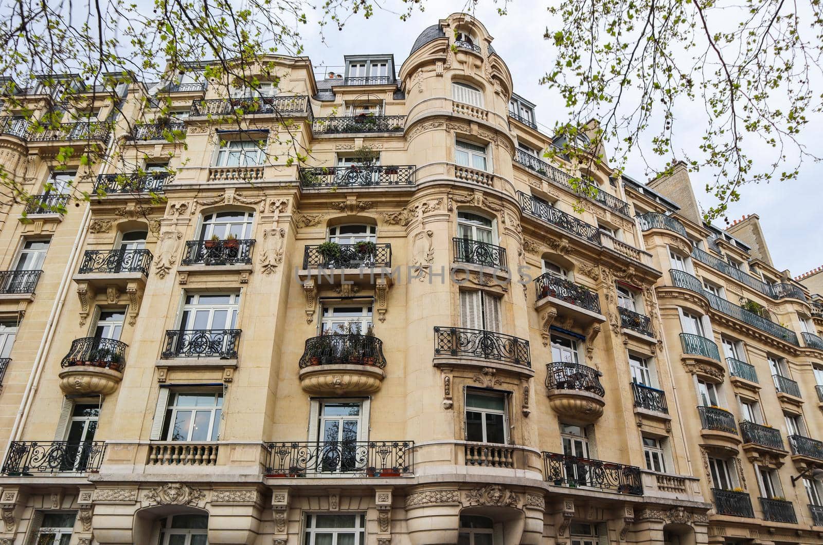 Architecture of Paris France. Facade of a traditional apartment building
