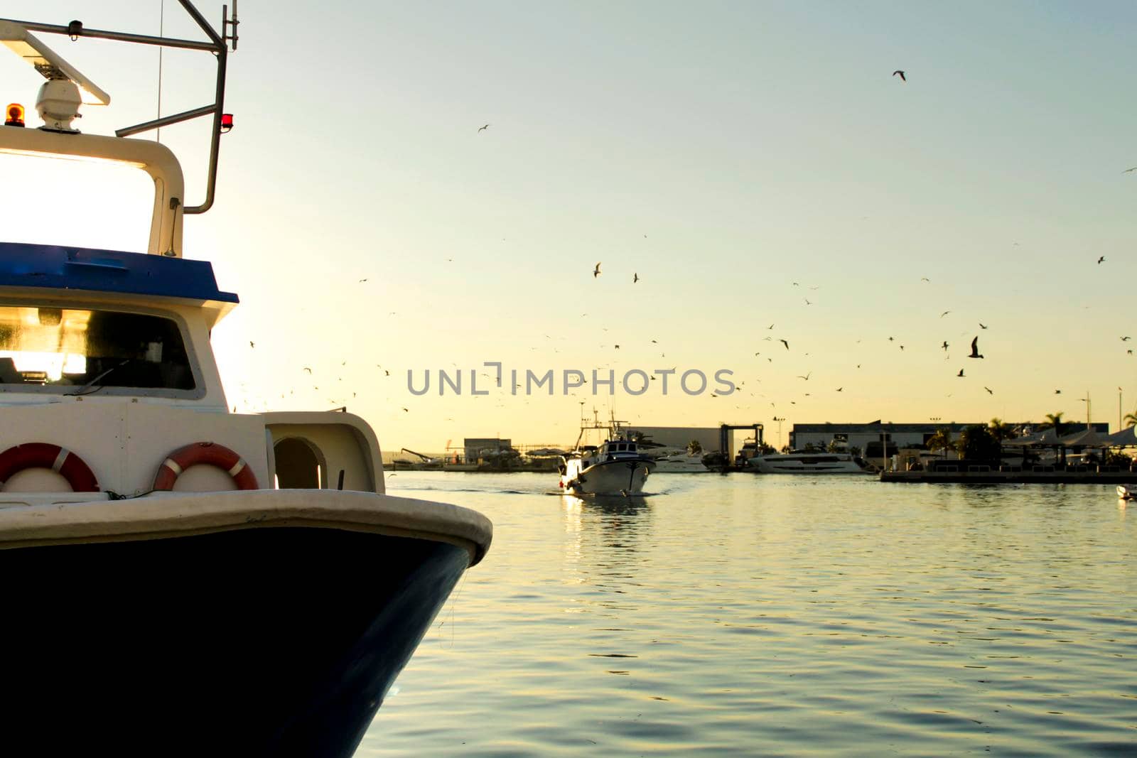 Fishing boat entering port in southern Spain, Santa Pola, Alicante