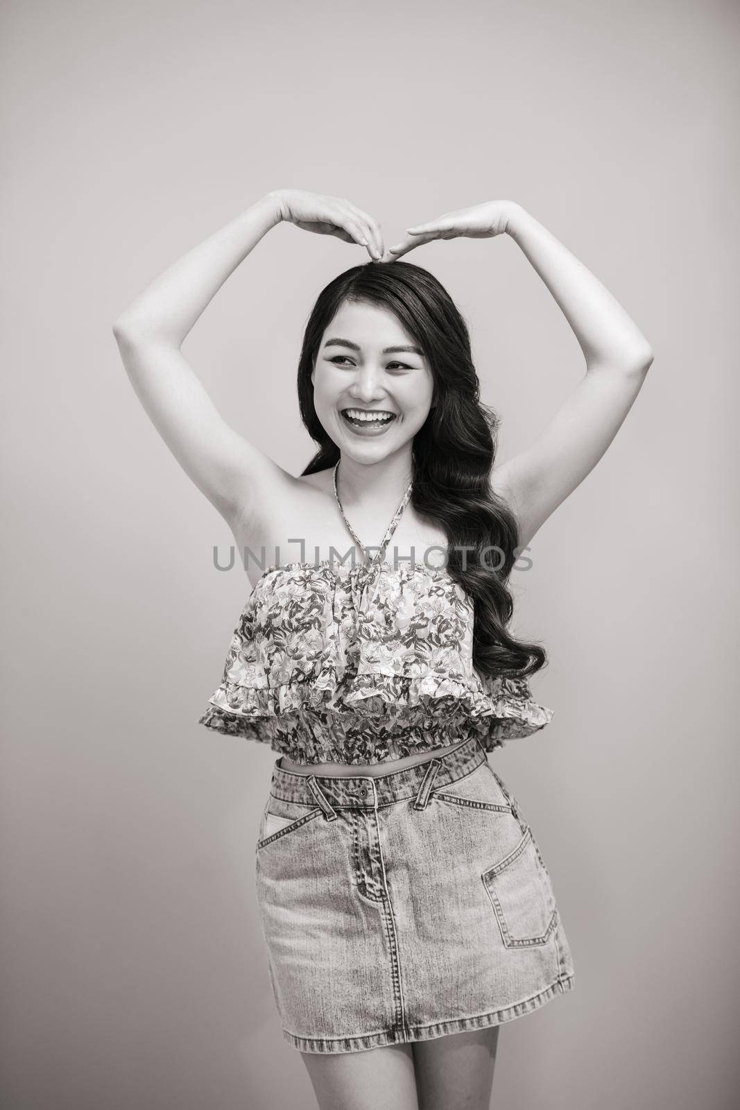 Young beautifull woman in summer dress black-white studio portrait.