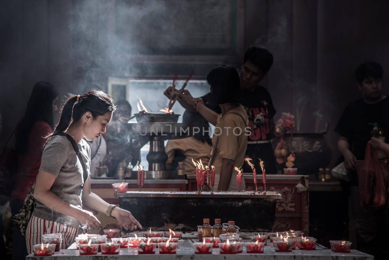 Bangkok, Thailand - 27 Oct 2019 : Interesting Asian women experience Thailand religion culture praying at Dragon Temple Kammalawat (Wat Lengnoeiyi), Wat Leng Noei Yi is the most important Chinese Buddhist temple in Bangkok.