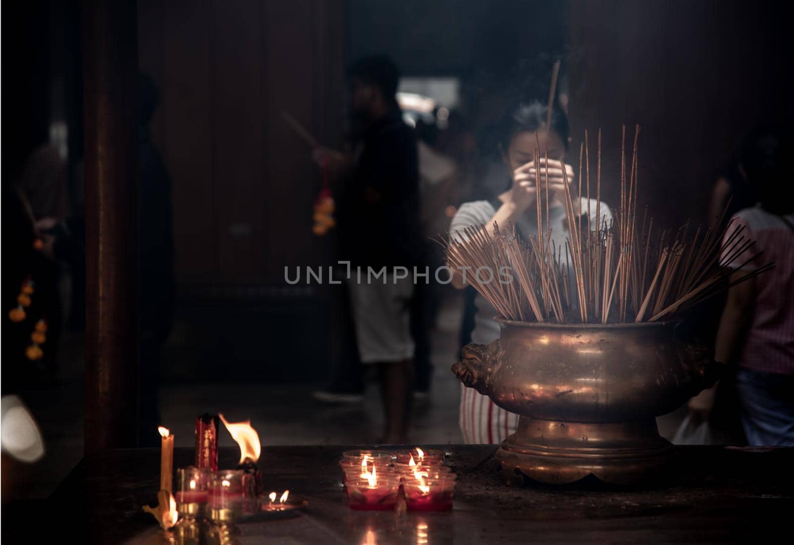 Bangkok, Thailand - 27 Oct 2019 : Interesting Asian women experience Thailand religion culture praying at Dragon Temple Kammalawat (Wat Lengnoeiyi), Wat Leng Noei Yi is the most important Chinese Buddhist temple in Bangkok.