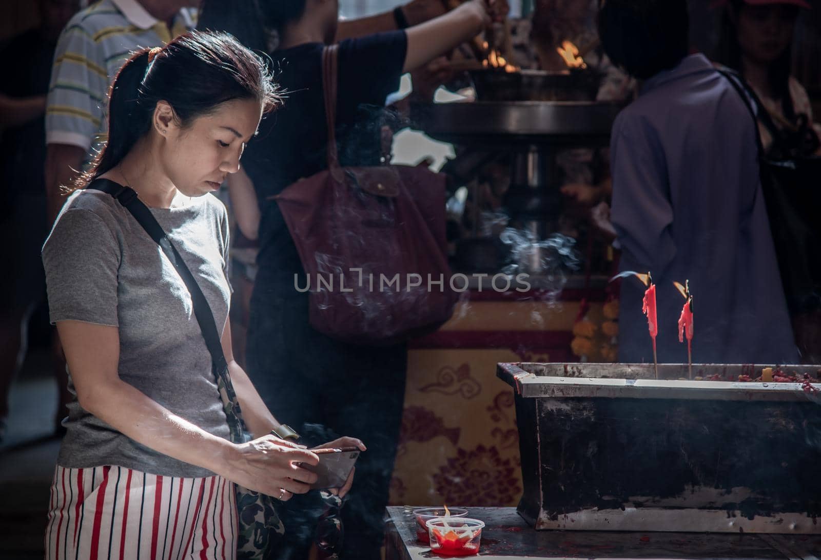 Bangkok, Thailand - 27 Oct 2019 : Interesting Asian women experience Thailand religion culture praying at Dragon Temple Kammalawat (Wat Lengnoeiyi), Wat Leng Noei Yi is the most important Chinese Buddhist temple in Bangkok.