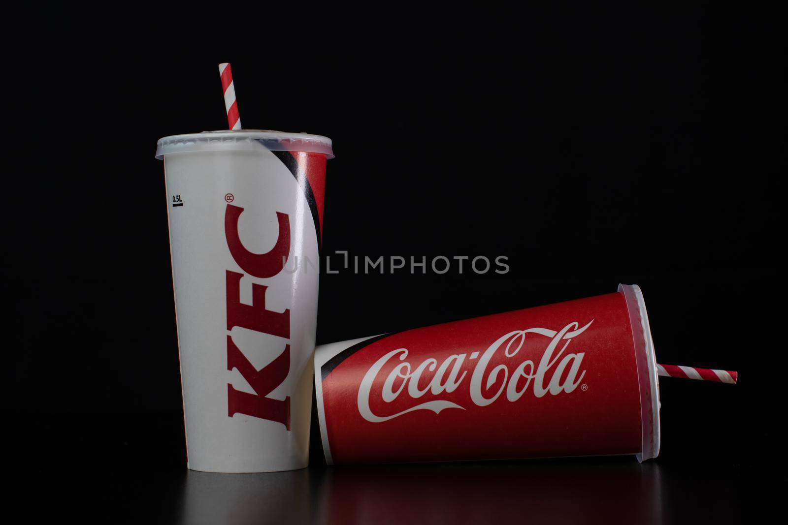 Drink in paper cup from KFC in  Bucharest, Romania, 2021 by vladispas