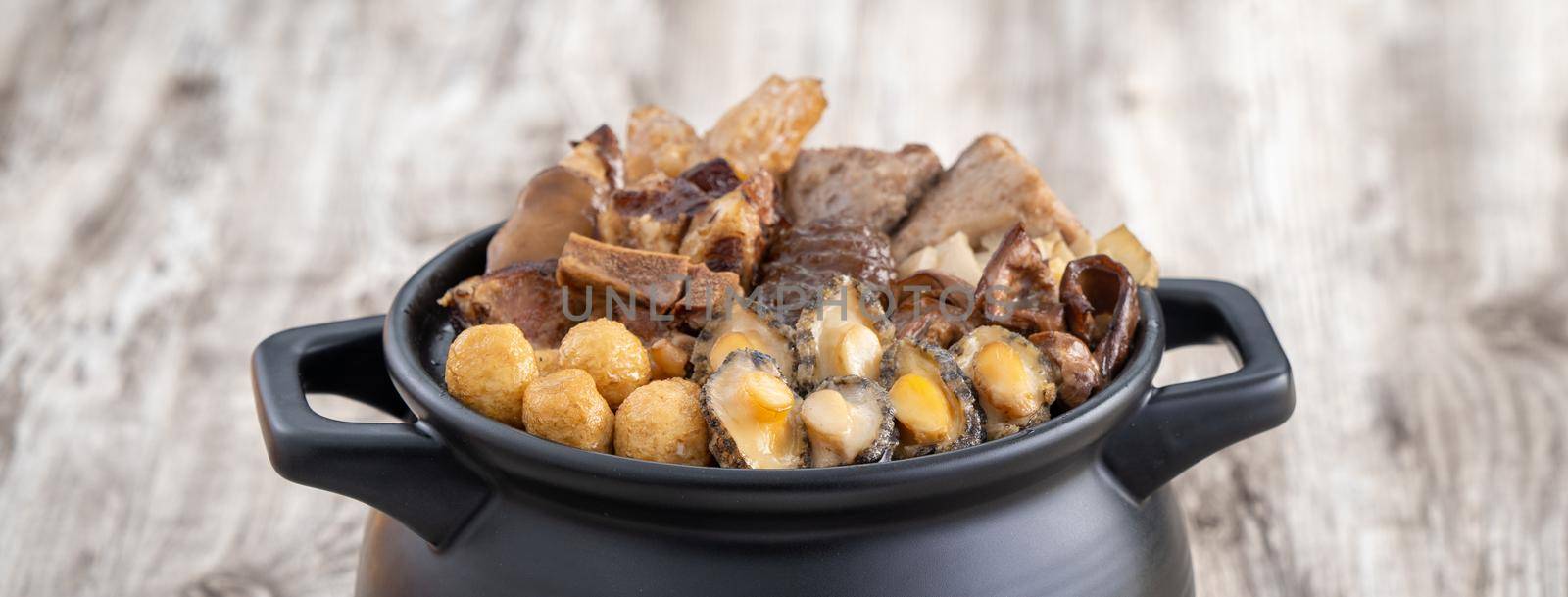 Traditional food of Chinese lunar new year, Buddha jumps over the wall, Chinese Soup Casserole dish, Buddha's Temptation, named Fo Tiao Qiang, close up.