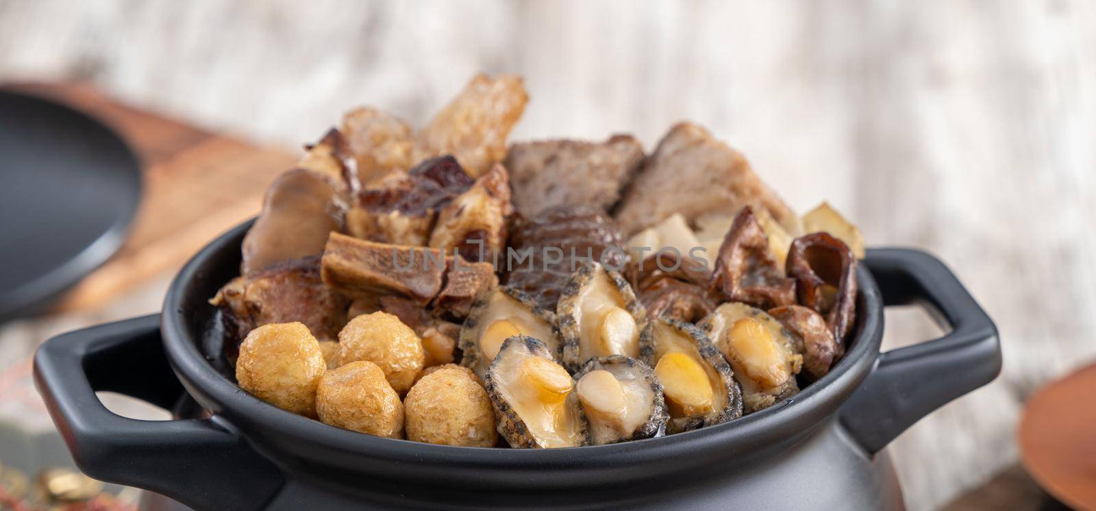 Traditional food of Chinese lunar new year, Buddha jumps over the wall, Chinese Soup Casserole dish, Buddha's Temptation, named Fo Tiao Qiang, close up.