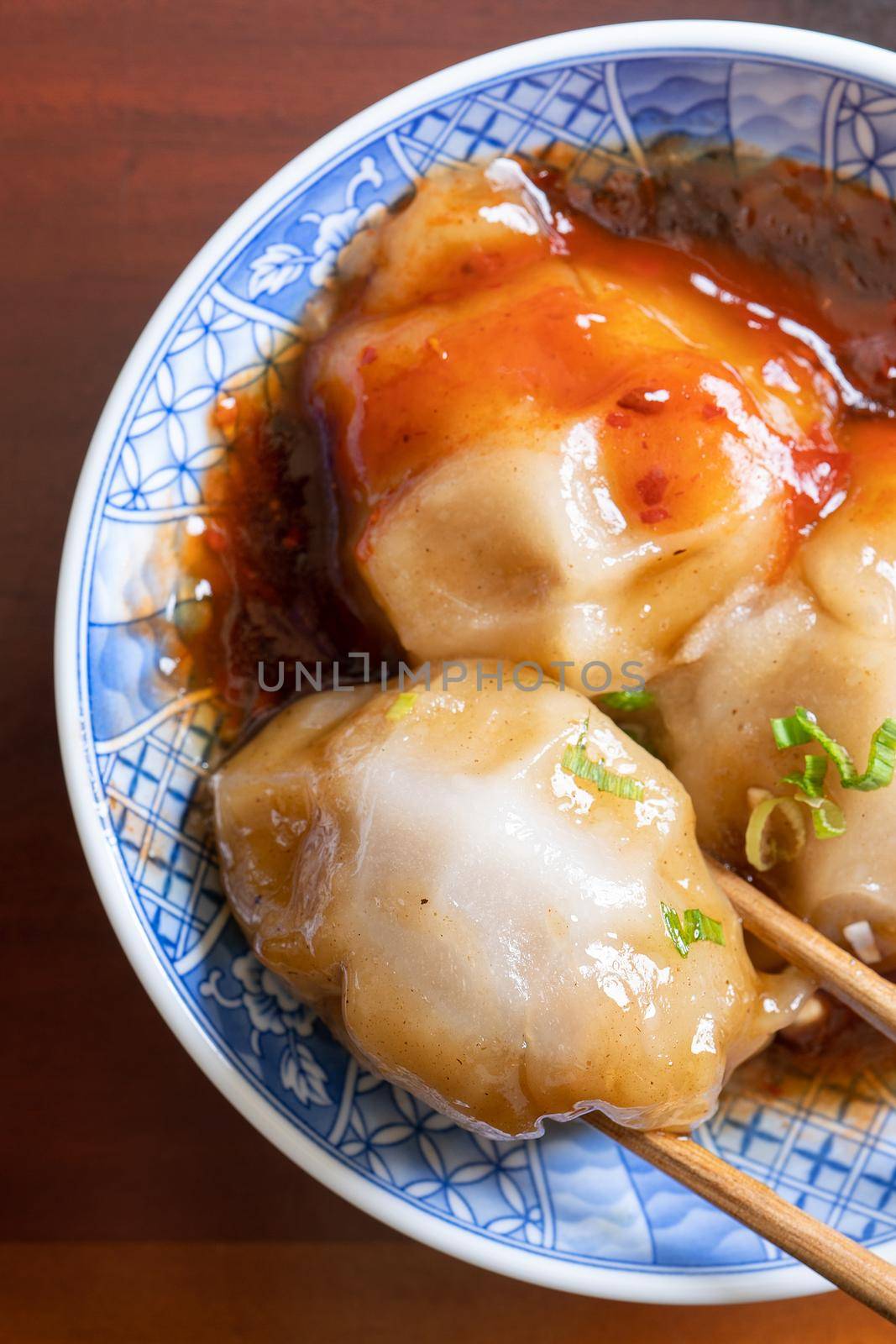 Bawan (Ba wan), Taiwanese meatball delicacy, delicious street food, steamed starch wrapped round shaped dumpling with pork inside, close up, copy space