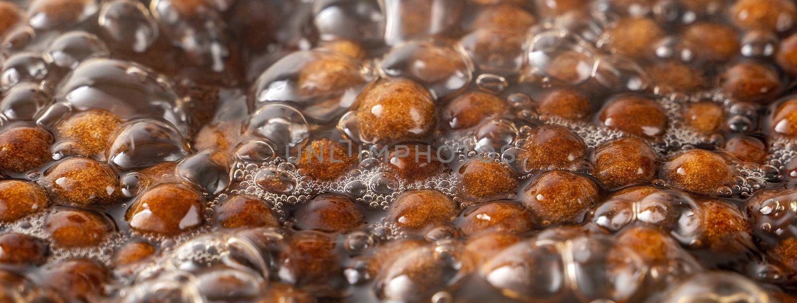 Cooking, boiling brown sugar flavor tapioca pearl balls, ingredient of bubble tea, preparing food and drink, close up, recipe cookbook steps design concept.