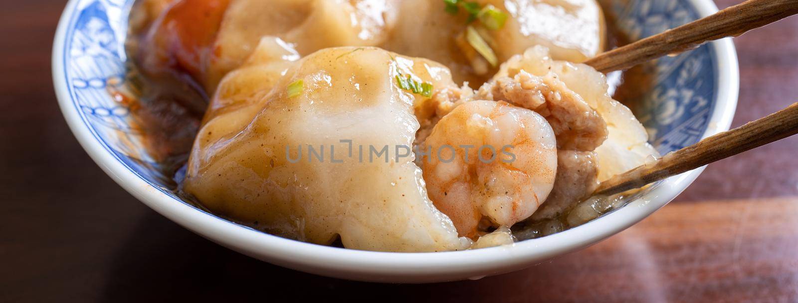 Bawan (Ba wan), Taiwanese meatball delicacy, delicious street food, steamed starch wrapped round shaped dumpling with pork inside, close up, copy space