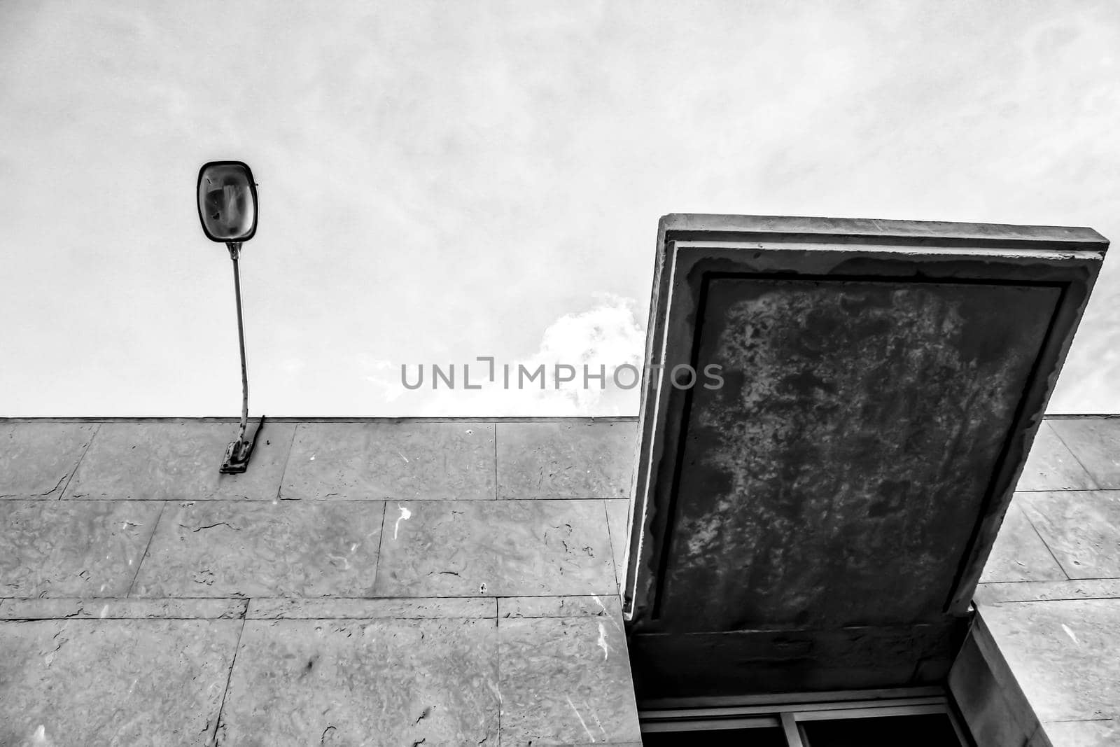Concrete facade and lamppost monochrome picture