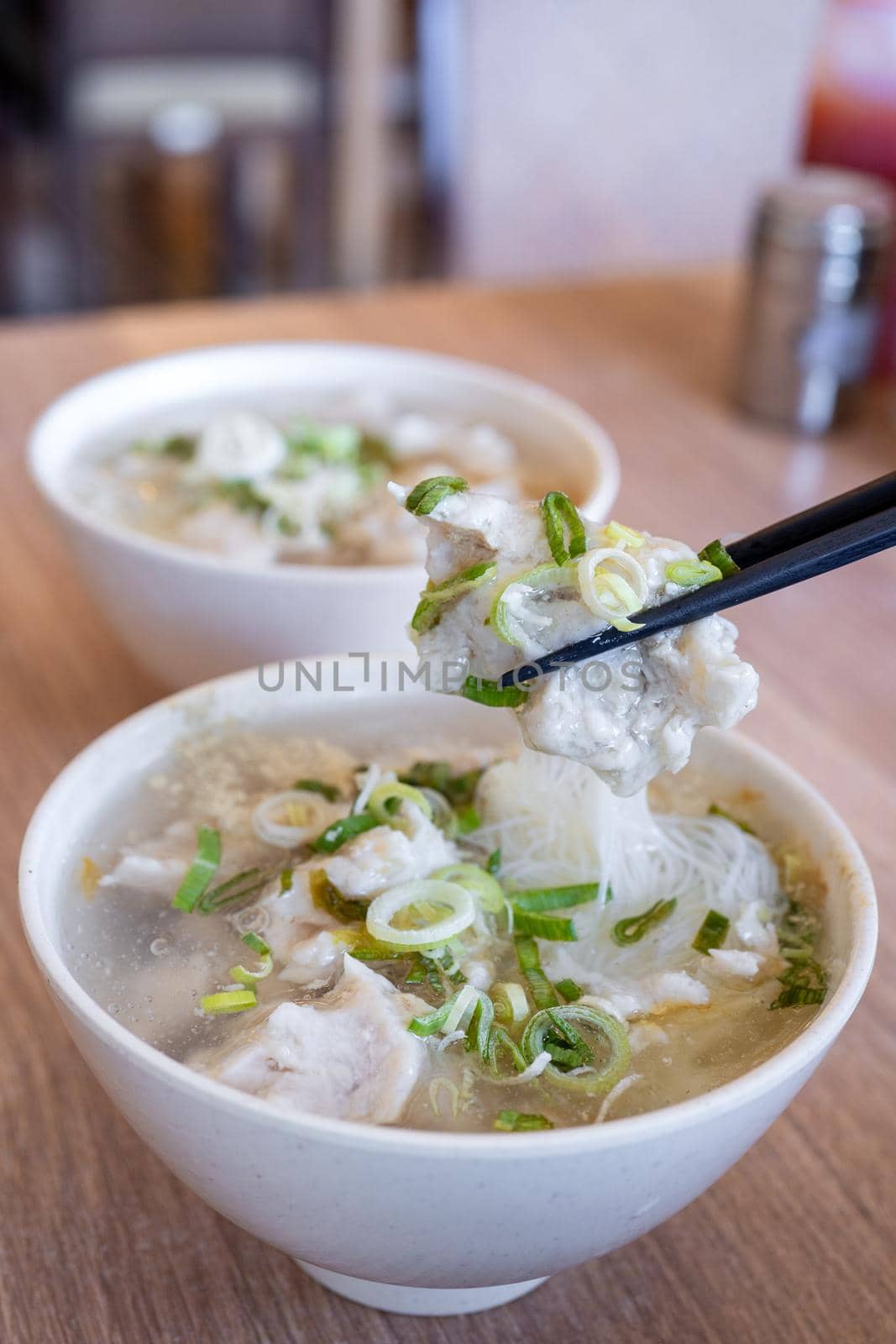 Delicious fish ball rice noodles in thick soup, common food in Tainan, Taiwan, Asia, Asian Taiwanese street delicacy cuisine, close up, lifestyle.