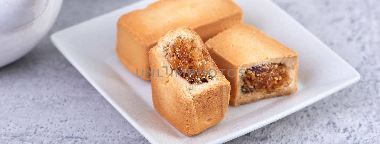Pineapple cake pastry - Taiwanese famous sweet delicious dessert food with tea, close up, copy space design.