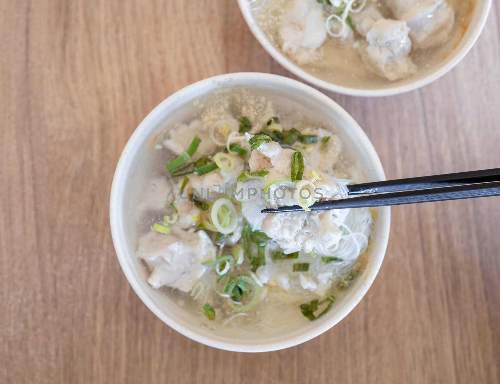 Delicious fish ball rice noodles in thick soup, common food in Tainan, Taiwan, Asia, Asian Taiwanese street delicacy cuisine, close up, lifestyle.