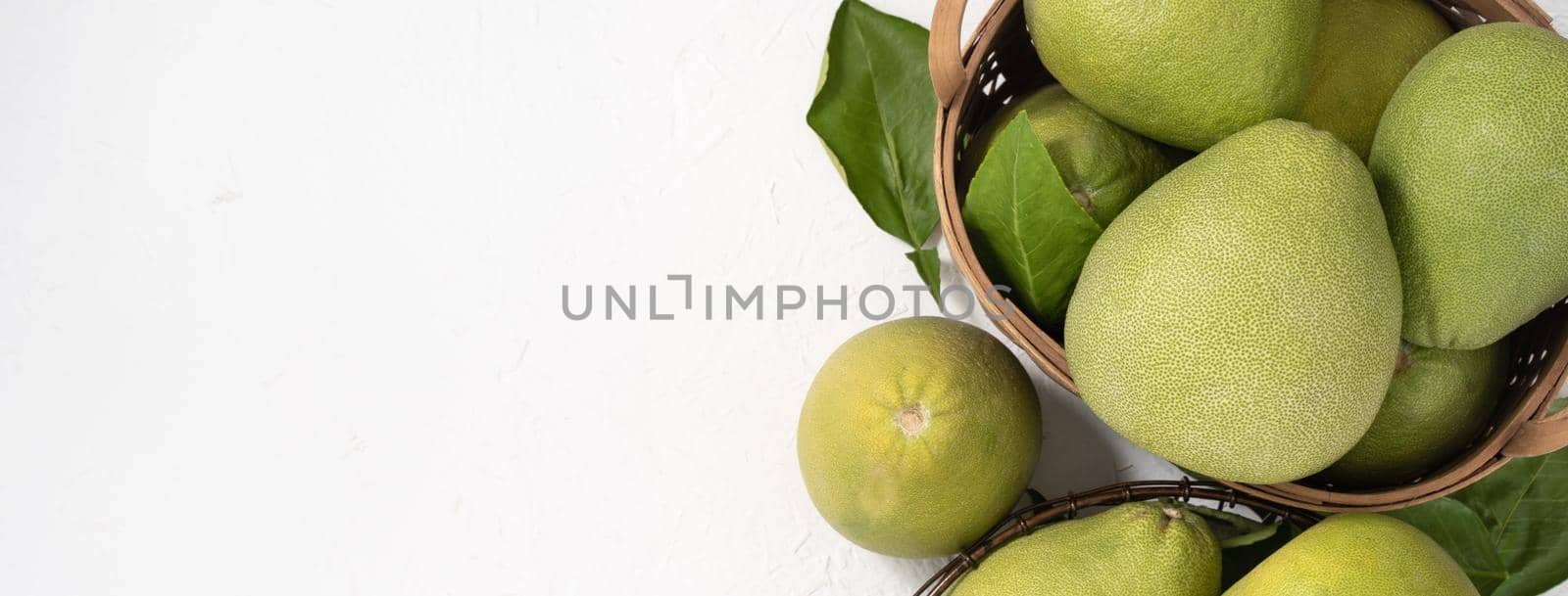 Fresh pomelo, pummelo, grapefruit, shaddock on white background, fruit for Mid-autumn festival, top view, flat lay.