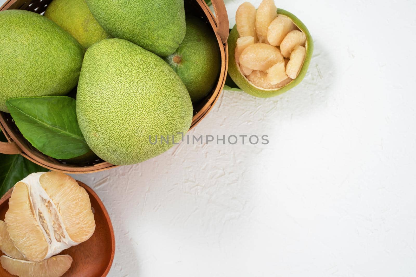 Fresh pomelo, pummelo, grapefruit, shaddock on white background, fruit for Mid-autumn festival, top view, flat lay.