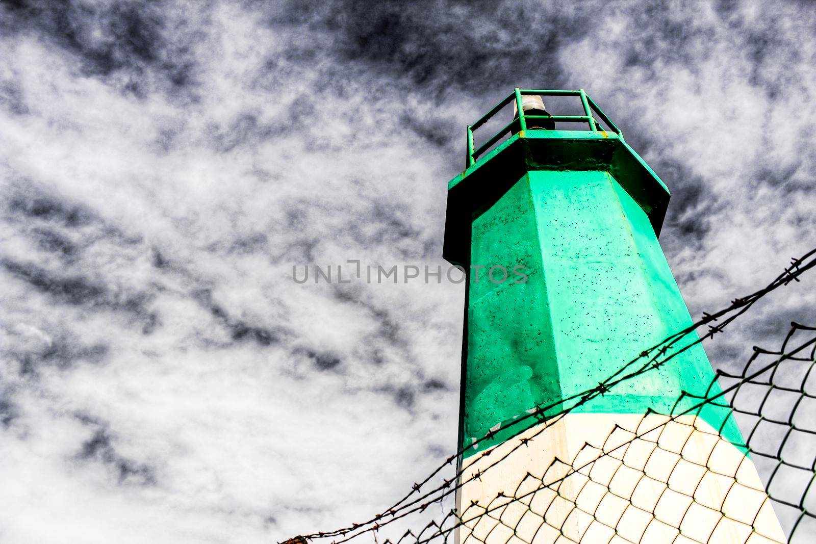 Colorful lighthouse in the dock in Santa Pola, Alicante, Spain
