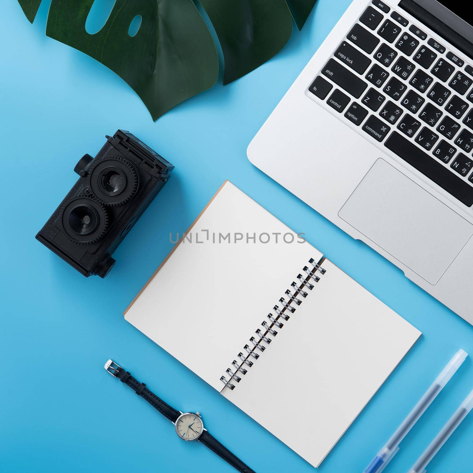 Concept of stylized home office table with fashion accessories, minimal interior, workspace design, close up, flat lay, copy space, top view, mockup