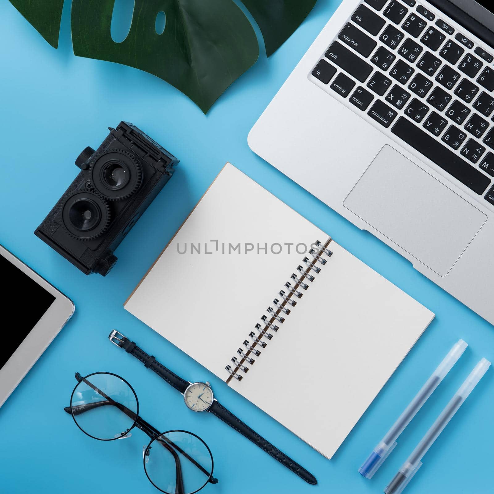 Concept of stylized home office table with fashion accessories, minimal interior, workspace design, close up, flat lay, copy space, top view, mockup
