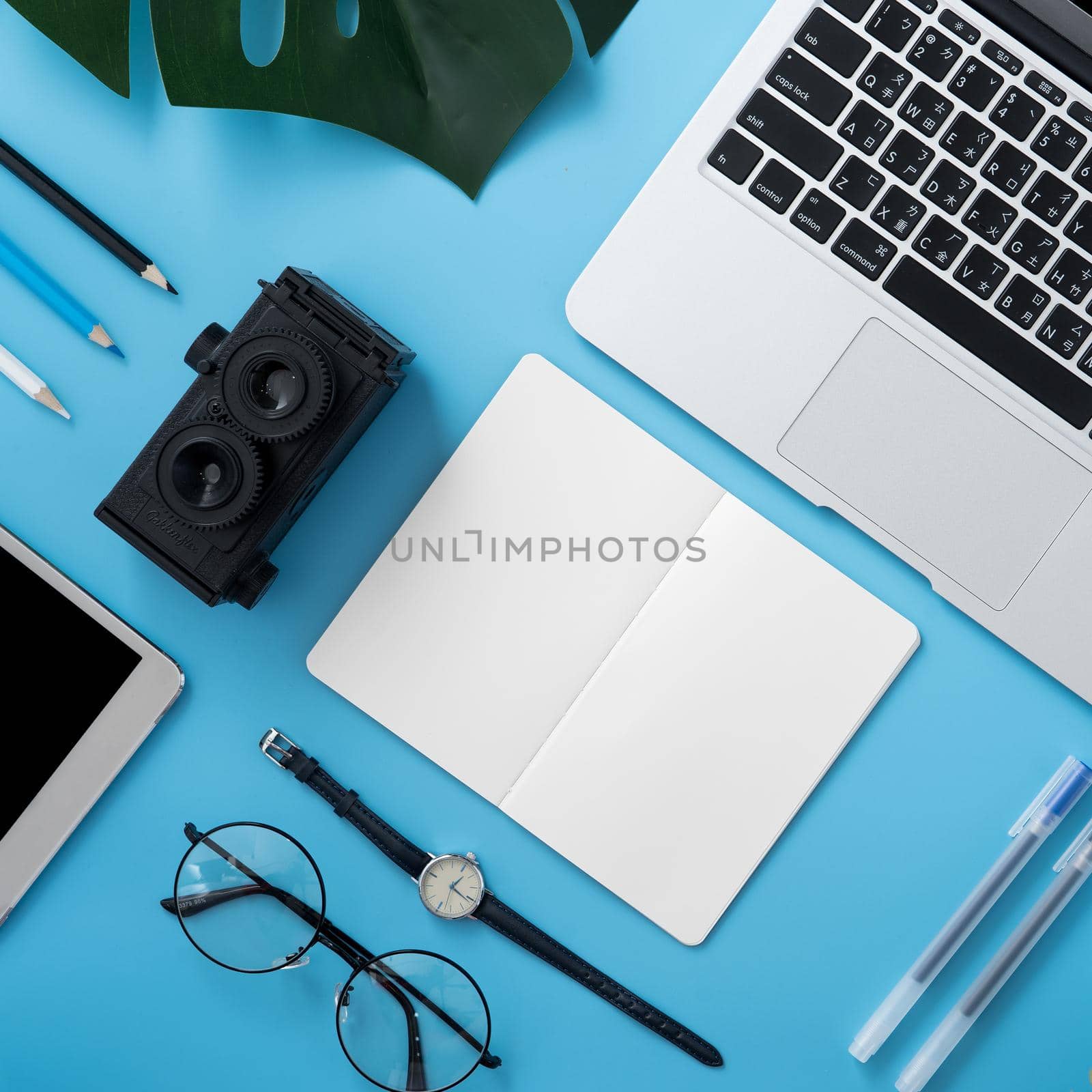 Concept of stylized home office table with fashion accessories, minimal interior, workspace design, close up, flat lay, copy space, top view, mockup