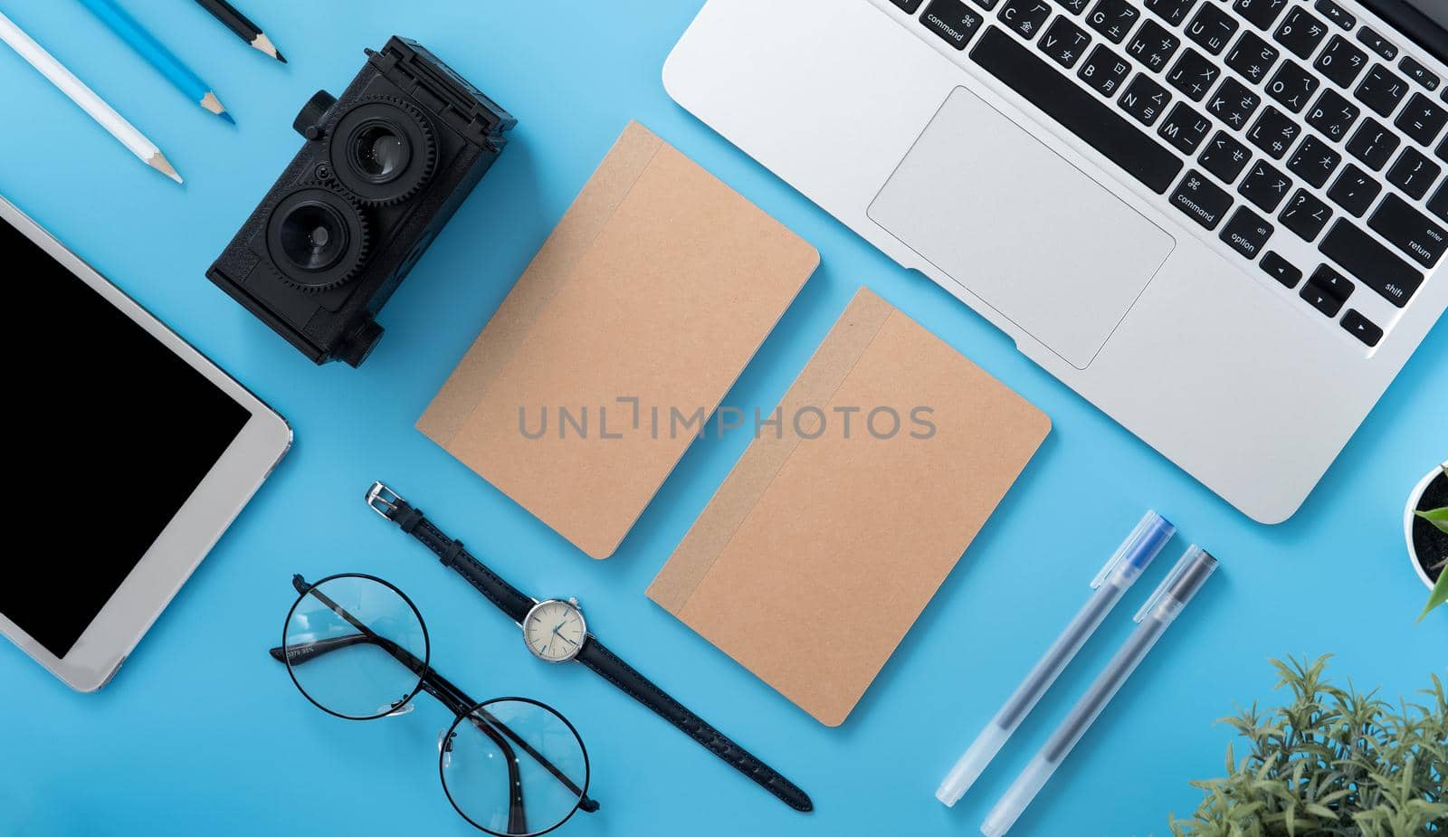 Concept of stylized home office table with fashion accessories, minimal interior, workspace design, close up, flat lay, copy space, top view, mockup